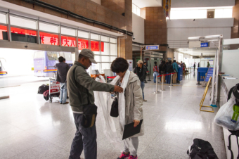 Receiving Tourist at Ghangri airport by Tibetan guide