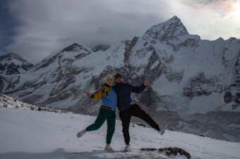 Posing to Photographer at Kala Patthar. Everest is in the background.