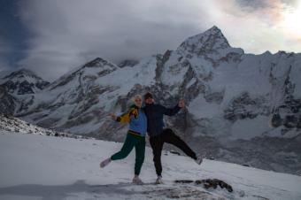 Posing to Photographer at Kala Patthar. Everest is in the background.